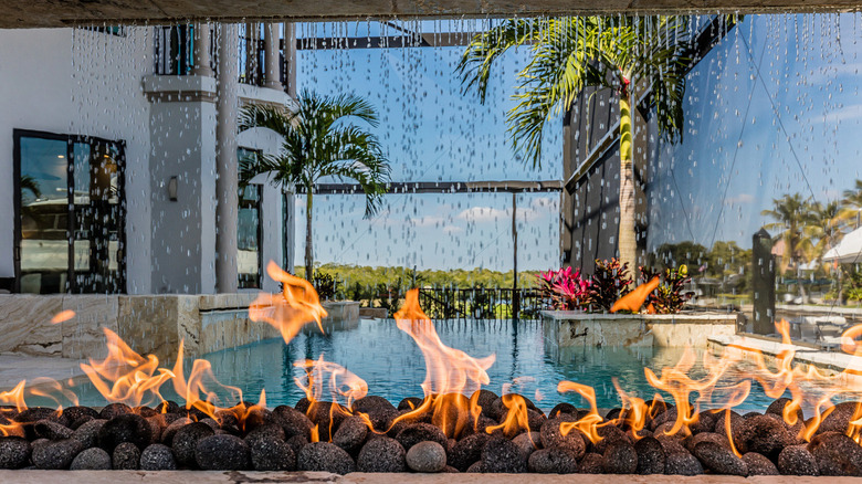 firepit poolside with waterfall