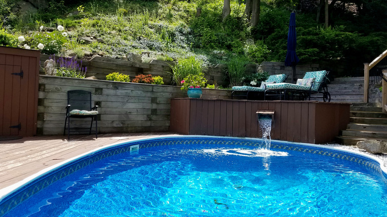 swimming pool and waterfall in elevated lounge