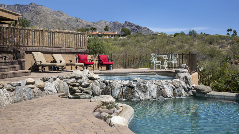 swimming pool with terraced patio