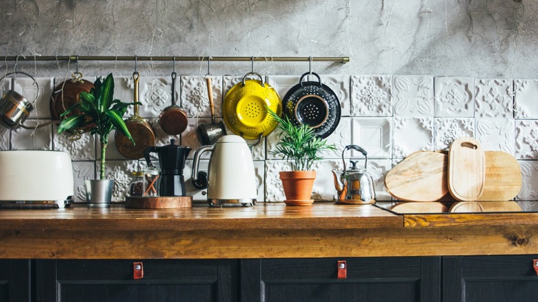 kitchen counter with hanging pots