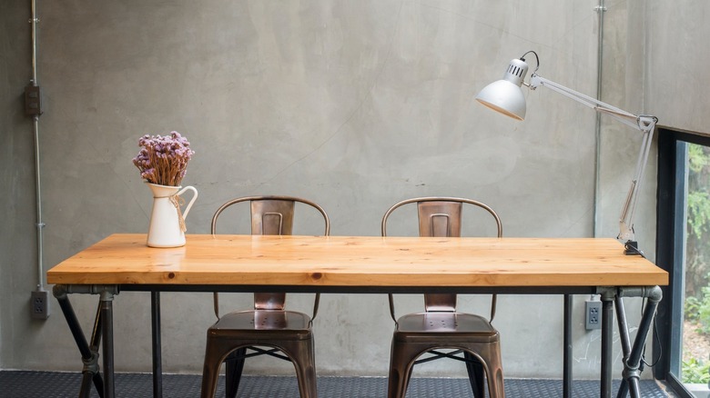 table with concrete wall