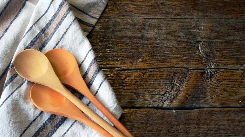 kitchen towel with wooden spoons