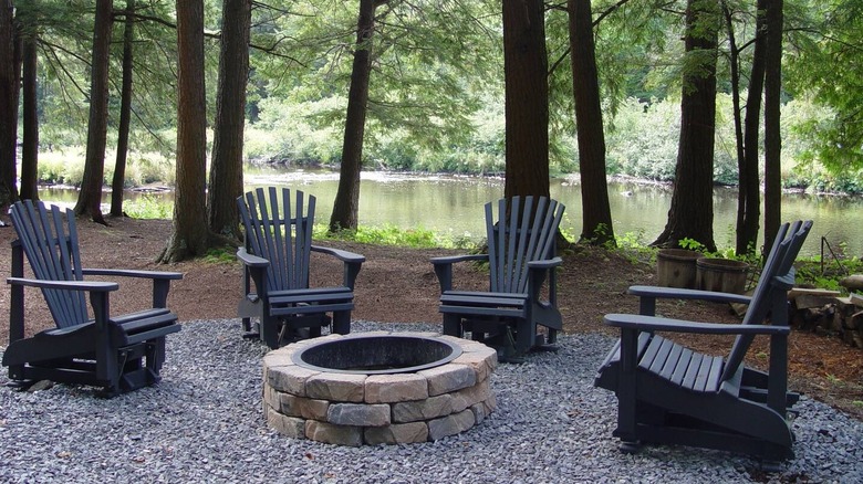 chairs and firepit by river