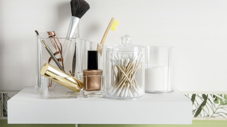 Bathroom shelf with acrylic containers