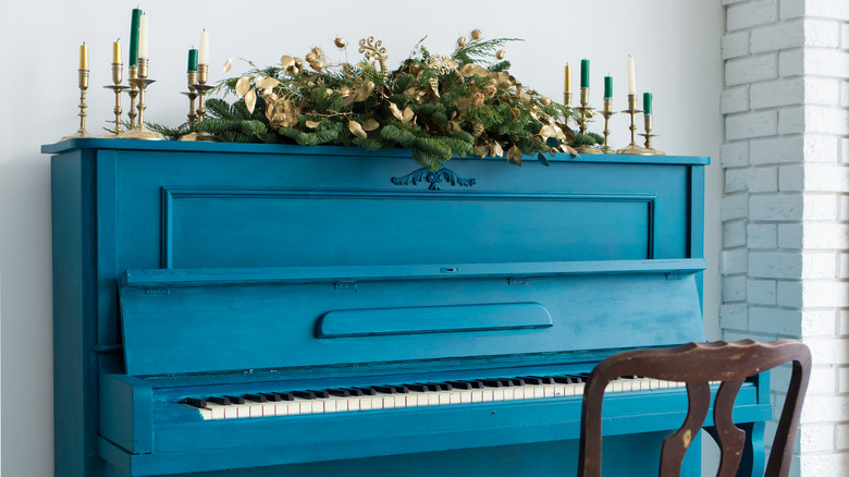 a garland above a piano