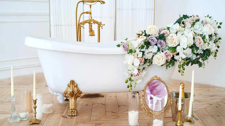 flowers on white bathtub