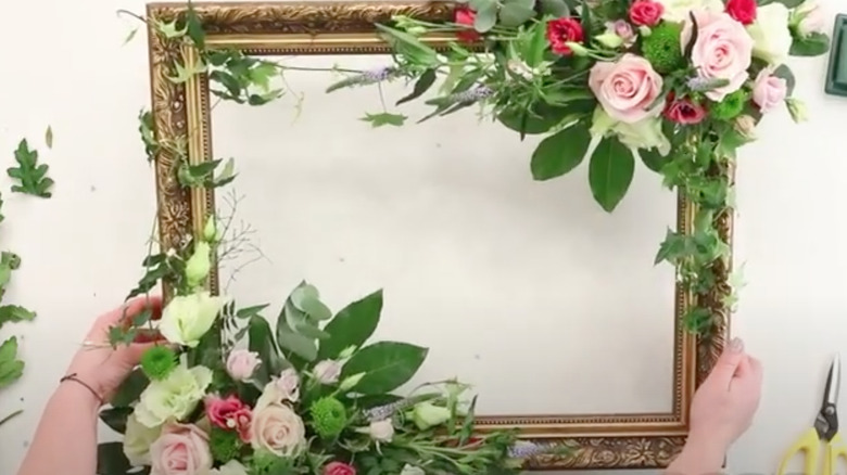 flowers around a gold frame