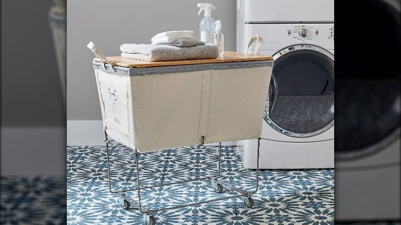 Raised wheeled laundry basket