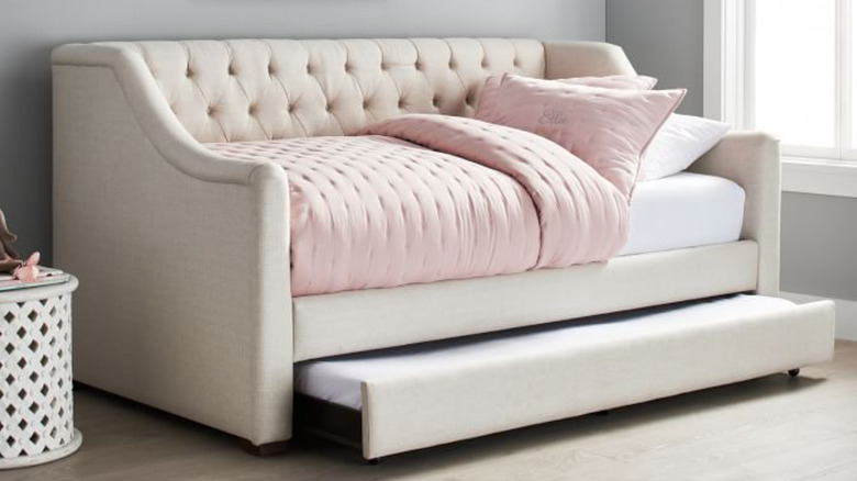 tufted off-white trundle bed