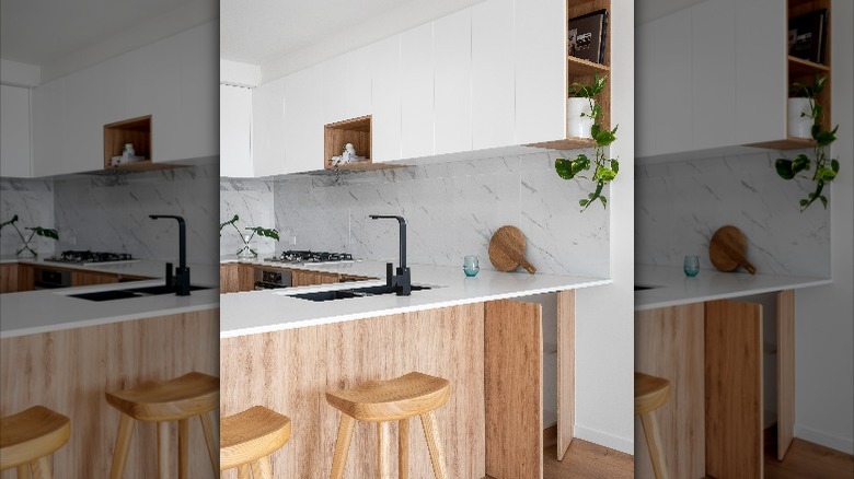 Bright white U-shaped kitchen