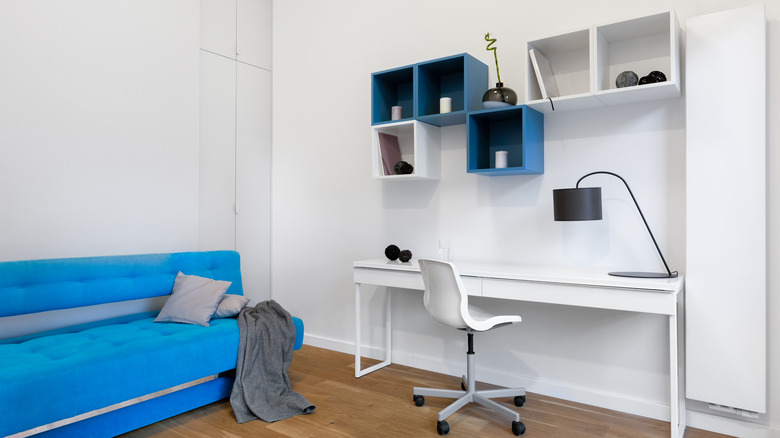 floating shelves above white desk