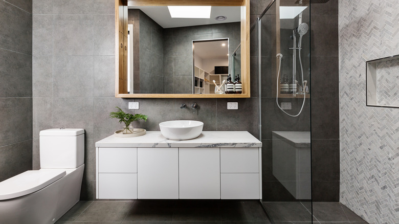 Gray bathroom with walk-in shower