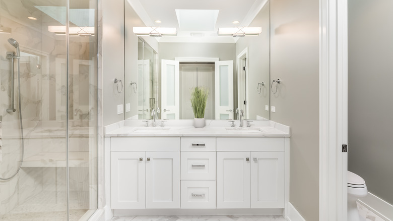 White bathroom with walk-in shower