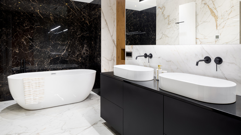 black vanity and marble wall