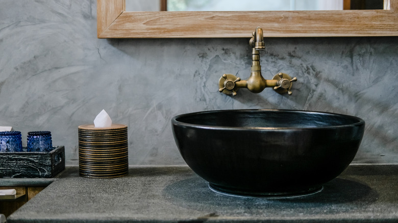 black sink with metal faucet