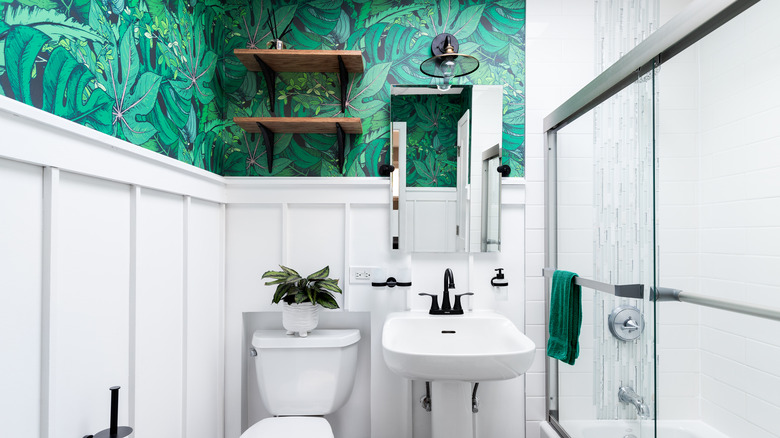 green wallpaper in small bathroom