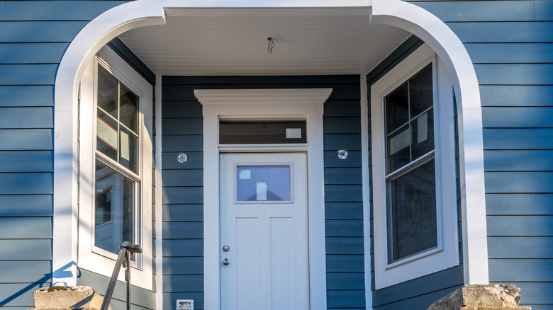 two windows around door