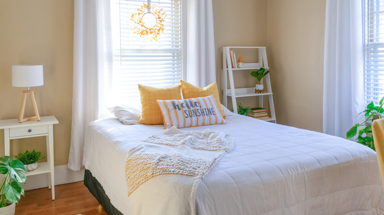 Yellow and white farmhouse bedroom