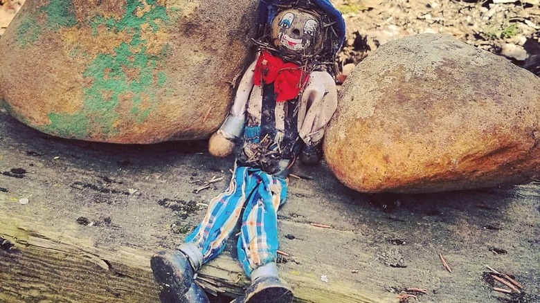 old doll in yard