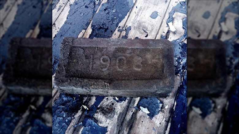 1908 brick in yard