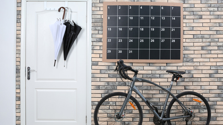 chalkboard calendar above bicycle