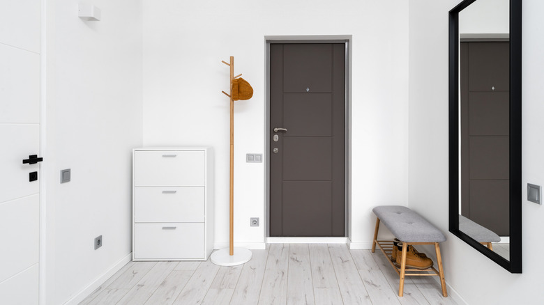 minimalist entryway with coat rack