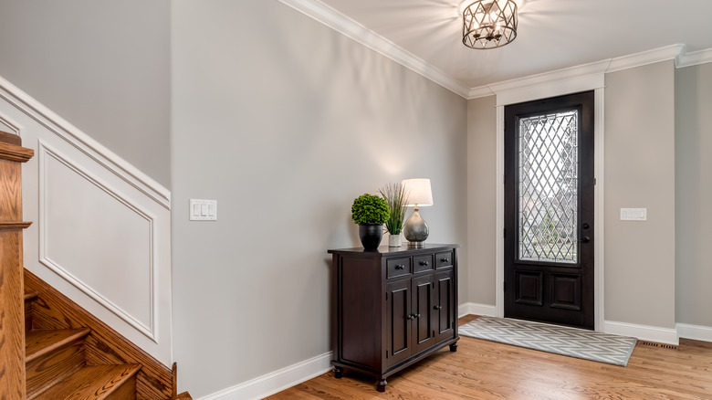 black accent cabinet in entryway