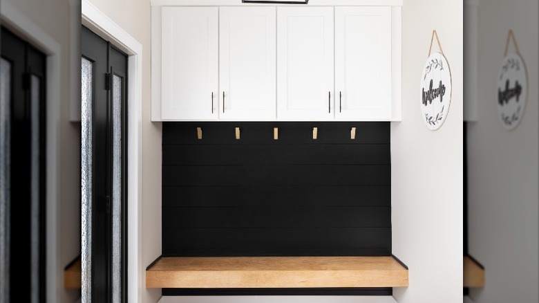 cabinets above wooden floating bench