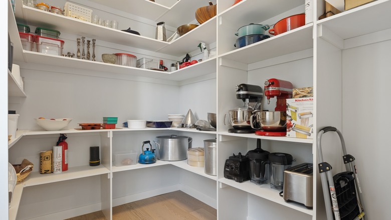white corner shelves in pantry