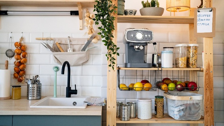 wooden freestanding pantry near sink