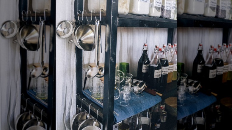 utensils hanging from metal shelves