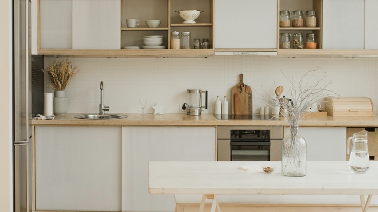 sliding white doors on cabinets