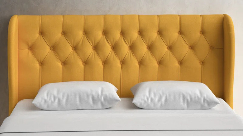 Tufted mustard yellow headboard