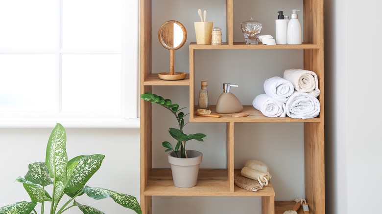 asymmetrical shelving unit with toiletries