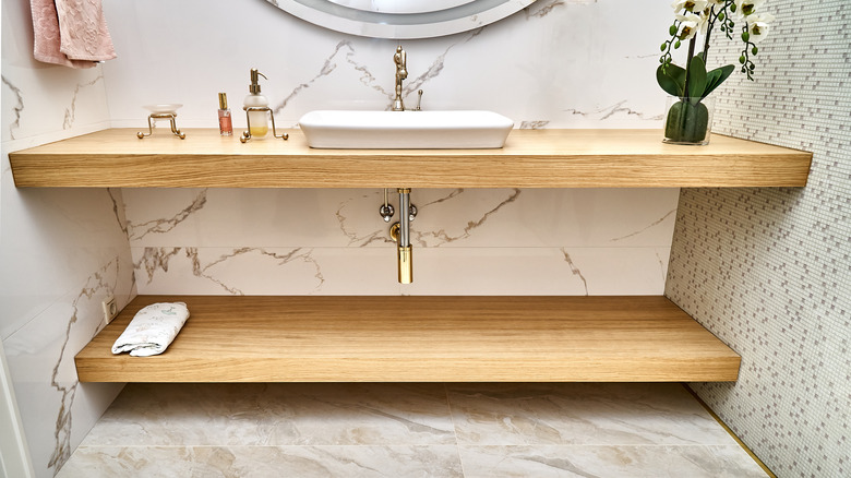wooden shelf beneath vanity