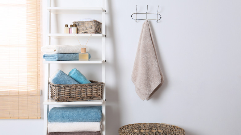 tall white bathroom shelving unit