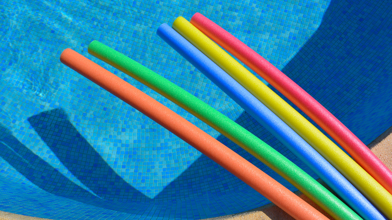 colorful pool noodles at pool