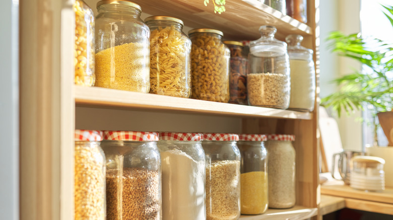 Pantry jars on shelving unit