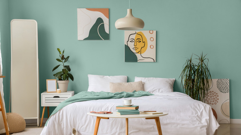 Relaxing bedroom with light blue-green walls