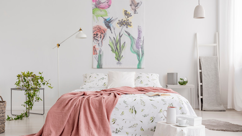 floral taspestry above bed