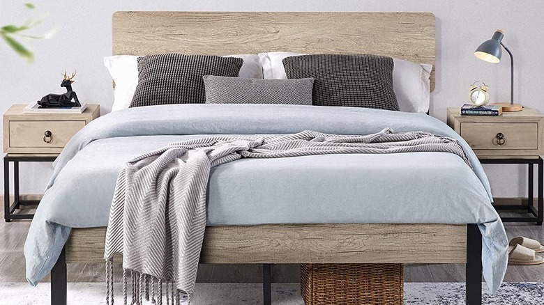 Gray-tinted headboard with blue bedding