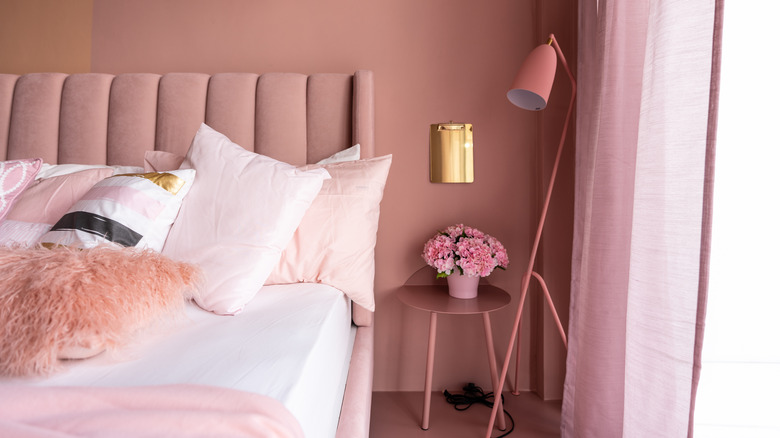 pink velvet headboard in bedroom