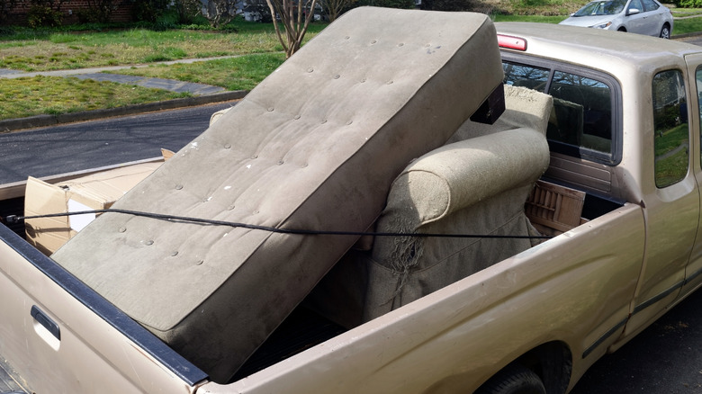 Truck loaded with used mattress