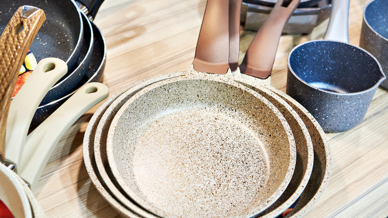 Non-stick pans on table