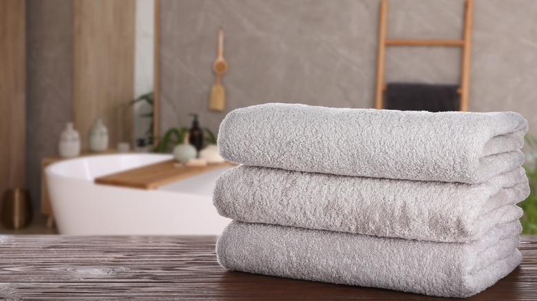 white folded towels in bathroom