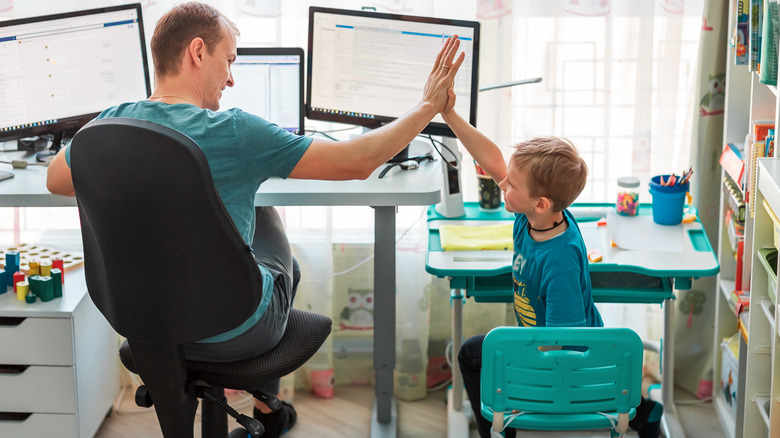 boy and father work together