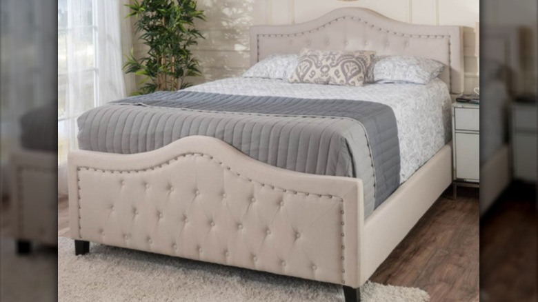 gray tufted bed