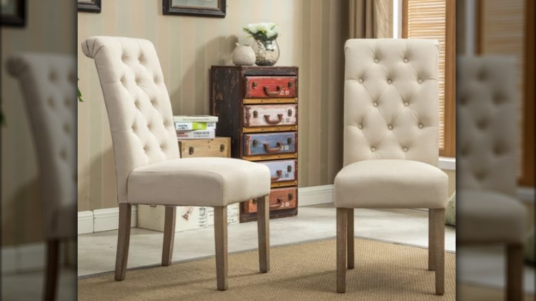 Tufted neutral-colored dining chairs