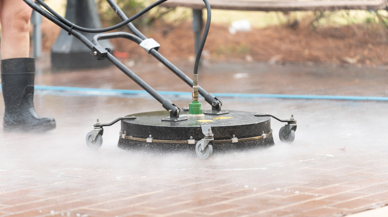 surface cleaner spraying patio
