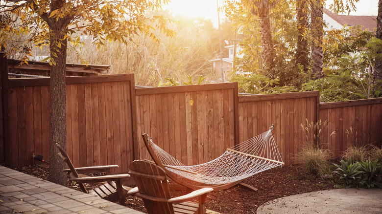 hammock against stepped fence